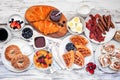 Breakfast or brunch table scene on a white wood background Royalty Free Stock Photo