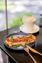 Breakfast with bruschetta with ham and cappuccino terrace Royalty Free Stock Photo