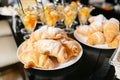 Breakfast buffet. Fresh pastry, crispy morning croissants, breakfast in hotel. Dessert fruit cocktail in cups