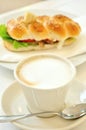 Breakfast with cappuccino and tuna sandwich Royalty Free Stock Photo