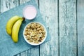 breakfast cereal, banana and milk on table with copy space Royalty Free Stock Photo