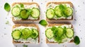 Breakfast, cereal bread sandwiches, cream cheese, sliced cucumber, with micro greenery on a light table