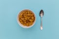 Breakfast cereal cornflakes in bowl with silver spoon Royalty Free Stock Photo