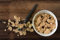 Breakfast cereal cornflakes in a bowl on a wooden table background Royalty Free Stock Photo