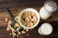 Breakfast cereal cornflakes with milk in a bowl on a wooden table background Royalty Free Stock Photo