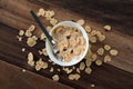 Breakfast cereal cornflakes with milk in a bowl on a wooden table background Royalty Free Stock Photo