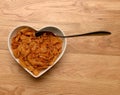 Breakfast cereal in heart shaped bowl Royalty Free Stock Photo