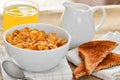 Breakfast cereal with toast and juice.