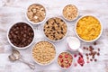 Breakfast cereals in bowls on rustic wooden table, top view Royalty Free Stock Photo