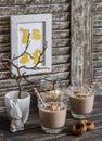 Breakfast chocolate, banana, oatmeal smoothies and Easter decorations - Easter ceramic rabbit, dry branches in a ceramic vase and