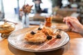 Breakfast closeup, oatmeal with salted caramel and prunes, in the original serving. Breakfast, pleasant morning, the