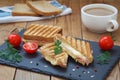 Breakfast with club or toast sandwiches on black tray