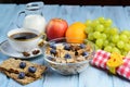 Breakfast with coffee, cereal and fruits selection