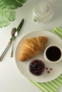 Breakfast, coffee and croissants with berry jam on white table. French croissant. Fresh buns meal, snack. Isoalted with copy space Royalty Free Stock Photo