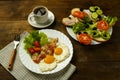 Breakfast coffee fried eggs with bacon and sandwiches on the table. Royalty Free Stock Photo