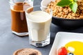 Breakfast with coffee, milk, cereals and fruits on the table. Generative AI Royalty Free Stock Photo