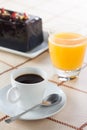 Breakfast with coffee, orange juice and plumcake Royalty Free Stock Photo