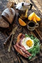 Breakfast with coffee pot fried egg and becon in rustic stile Royalty Free Stock Photo
