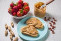 Breakfast with coffee and sandwiches with peanut paste and strawberries Royalty Free Stock Photo