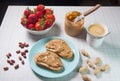 Breakfast with coffee and sandwiches with peanut paste and strawberries Royalty Free Stock Photo