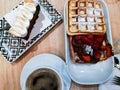 Breakfast of coffee, waffle with nutella and strawberries