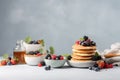 Breakfast composition with fresh pancakes and berries created with Generative AI technology Royalty Free Stock Photo