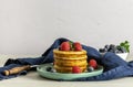 Breakfast concept with american pancakes with raspberries, mint, and blueberries