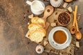 Breakfast concept with a cup of coffee, croissants, milk jug, and decorative crochet pumpkins Royalty Free Stock Photo