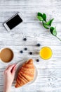 Breakfast concept with flowers on wooden background top view Royalty Free Stock Photo