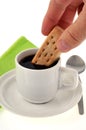 Dipping a shortbread in a cup of coffee Royalty Free Stock Photo