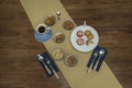 Breakfast, cookies, dry fruits, knife and fork on wooden table Royalty Free Stock Photo