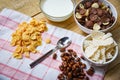 Breakfast Cornflakes and various cereals in bowl and milk cup on wooden background for cereal healthy food in the mor