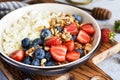 Breakfast - cottage cheese with berries and a cup of coffee, top view. Granola with nuts, honey and strawberries Royalty Free Stock Photo