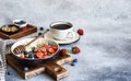 Breakfast - cottage cheese with berries and a cup of coffee, top view. Granola with nuts, honey and strawberries Royalty Free Stock Photo