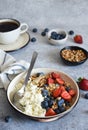 Breakfast - cottage cheese with berries and a cup of coffee, top view. Granola with nuts, honey and strawberries Royalty Free Stock Photo