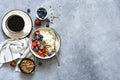 Breakfast - cottage cheese with berries and a cup of coffee, top view. Granola with nuts, honey and strawberries Royalty Free Stock Photo