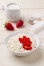 Breakfast of cottage cheese with strawberries and cream jug Royalty Free Stock Photo