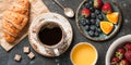 Breakfast with croissant, coffee, orange juice and berries Royalty Free Stock Photo