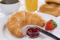 Breakfast with a croissant, coffee and orange juice Royalty Free Stock Photo