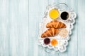 Breakfast with croissants, coffee, jam, orange juice and muesli Royalty Free Stock Photo