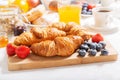 Breakfast with croissants  coffee  juice  jam  cereals and fresh fruits Royalty Free Stock Photo