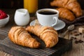 Breakfast with croissants, coffee, orange juice and berries Royalty Free Stock Photo