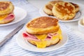 Breakfast crumpet sandwich, british pancake scones burger with cheese and ham Royalty Free Stock Photo