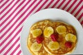 Breakfast crumpets with banana and raspberry Royalty Free Stock Photo