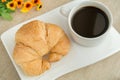 Breakfast with cup of black coffee and croissant Royalty Free Stock Photo