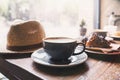 Breakfast, cups of coffee and fresh croissant on a table in a coffee shop