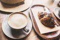 Breakfast, cups of coffee and fresh croissant on a table in a coffee shop