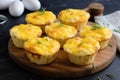 A breakfast delight: Bacon and egg muffin cups with cheese and vegetables