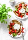 Breakfast, dessert table - crepes with strawberries and cream on a white background, top view. Royalty Free Stock Photo