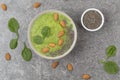 Breakfast Detox Green Smoothie from Banana, Spinach, chia seeds and almonds in the Bowl. Concept of diet and healthy eating. Royalty Free Stock Photo